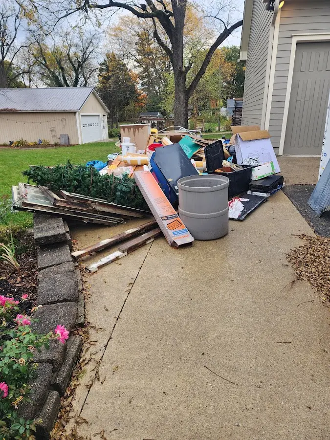 Dumpster being loaded with debris for 10 Yard Dumpster Rental in Harrisburg